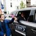 Flags are distributed from vehicles during the Memorial Day parade on Monday, May 27. Daniel Brenner I AnnArbor.com
